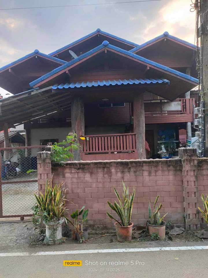 For SaleHousePhrae : 📌This price is ready to transfer 📍 1.59 million baht. Size 69 sq m. House with land. 2-story teak house Good location in front of the house next to the road. The back of the house is next to a creek in Long District, Ta Pha Mok Subdistrict, Phrae Province