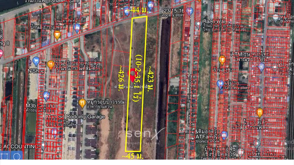 For SaleLandPathum Thani,Rangsit, Thammasat : Land for sale, Khlong 9, next to Rangsit-Nakhon Nayok Road, area 10 and a half rai, in a housing estate area