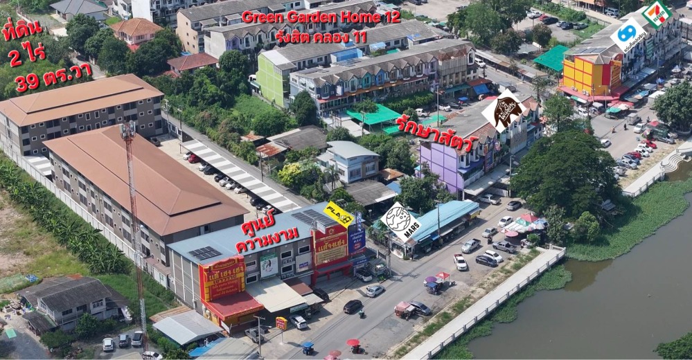 For SaleLandPathum Thani,Rangsit, Thammasat : Good location for trading all year round! Land for sale, 2 rai 39 sq.wa, suitable for building apartments, with divided shop lots, Khlong 11, Rangsit-Nakhon Nayok Road, next to Wat Srabue, Pathum Thani