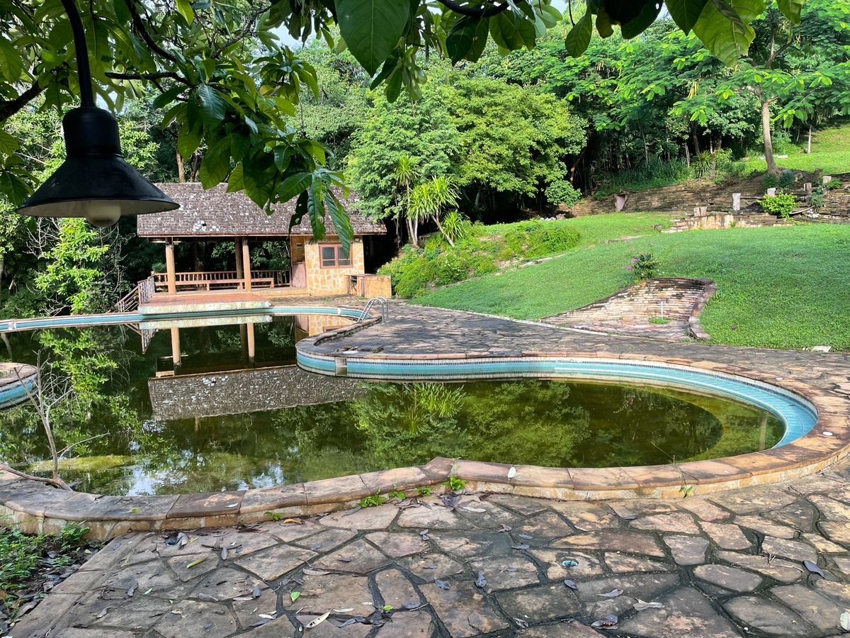 For SaleLandSaraburi : 📢 Beautiful Land in Muak Lek — Thoughtfully landscaped with a natural stream running through the property. Fresh air and scenic surroundings, located near the entrance to Khao Yai National Park.