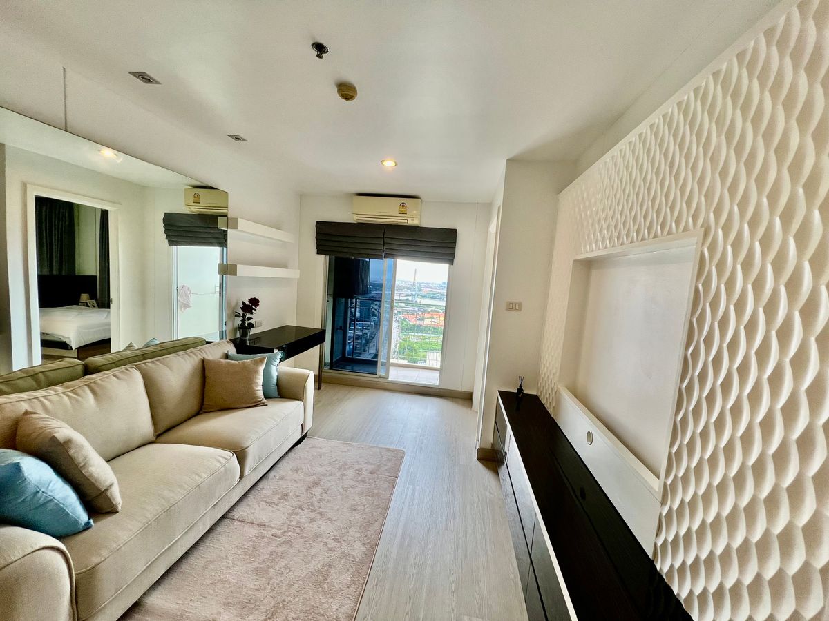 For SaleCondoRama3 (Riverside),Satupadit : For Sale: Lumpini Park Riverside Rama 3 – Corner Unit with Stunning River View  Experience riverside living along the Chao Phraya River at Rama 3. A beautifully designed corner unit with luxury built-in furnishings, perfect for both living and investment.