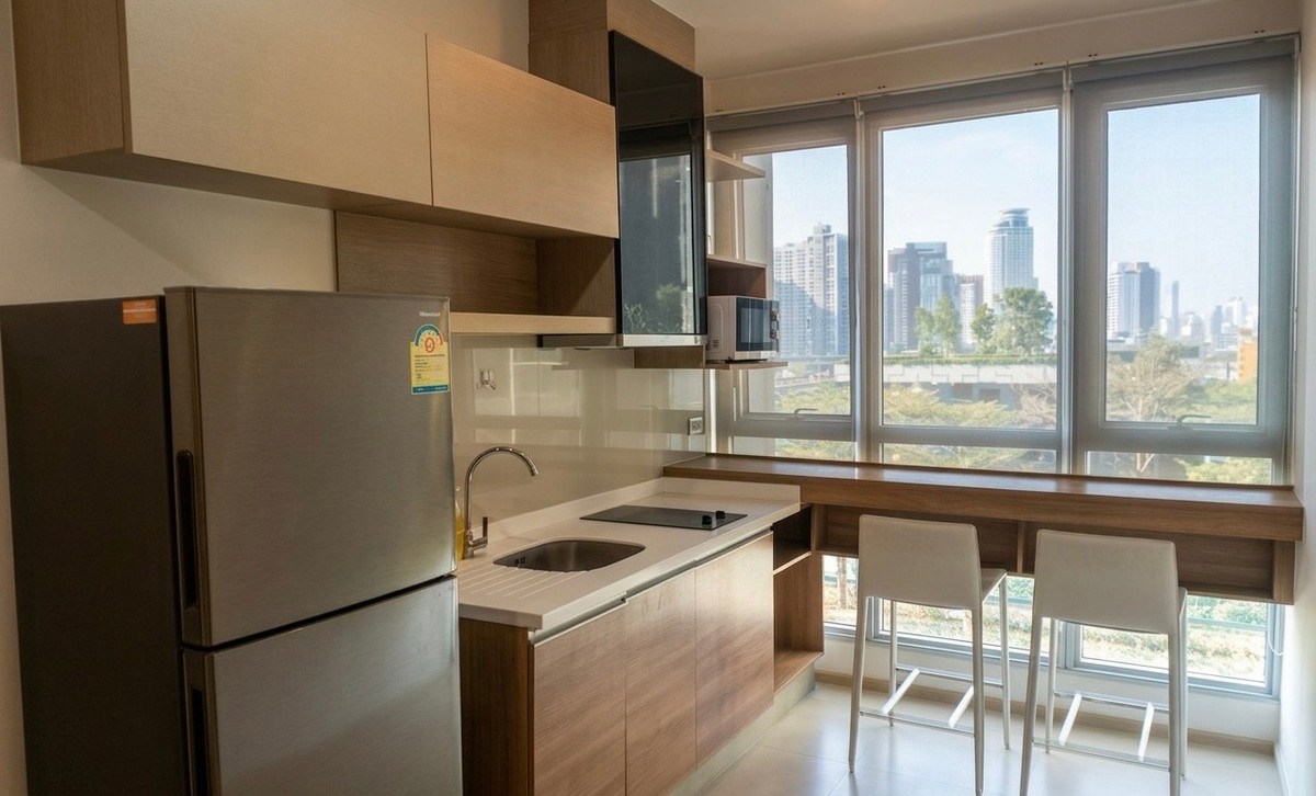 For RentCondoOnnut, Udomsuk : Rhythm Sukhumvit 50 Condo for Rent 🌤️ Open city view, unblocked and airy ☕ Cozy corner to enjoy the view with your coffee🚆 Close to BTS On Nut