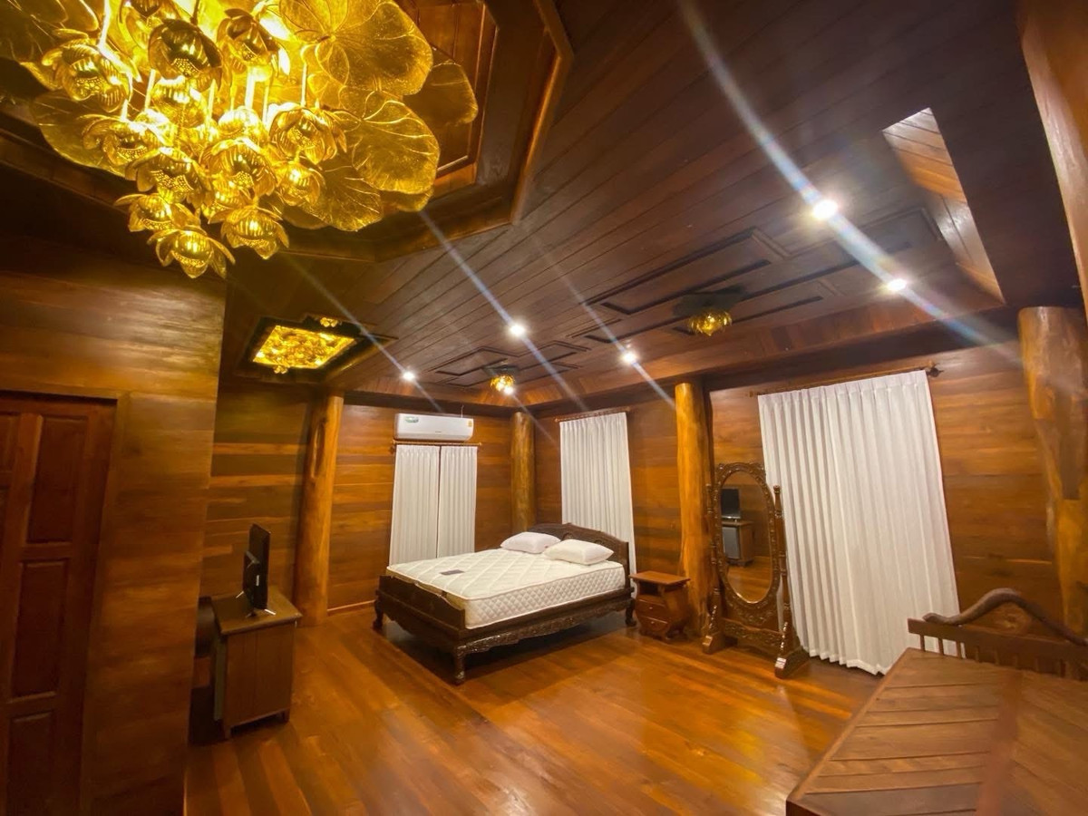 For SaleHousePhrae : Old teak houses for sale, large and small. Complete with train carriages On land in a prime location, Phrae Province, over 8 rai, next to the road along the irrigation canal, mountain view, cool and shady atmosphere mixed with the scent of nature in every