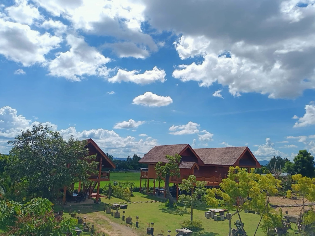 For SaleHousePhrae : Old teak houses for sale, large and small. Complete with train carriages On land in a prime location, Phrae Province, over 8 rai, next to the road along the irrigation canal, mountain view, cool and shady atmosphere mixed with the scent of nature in every