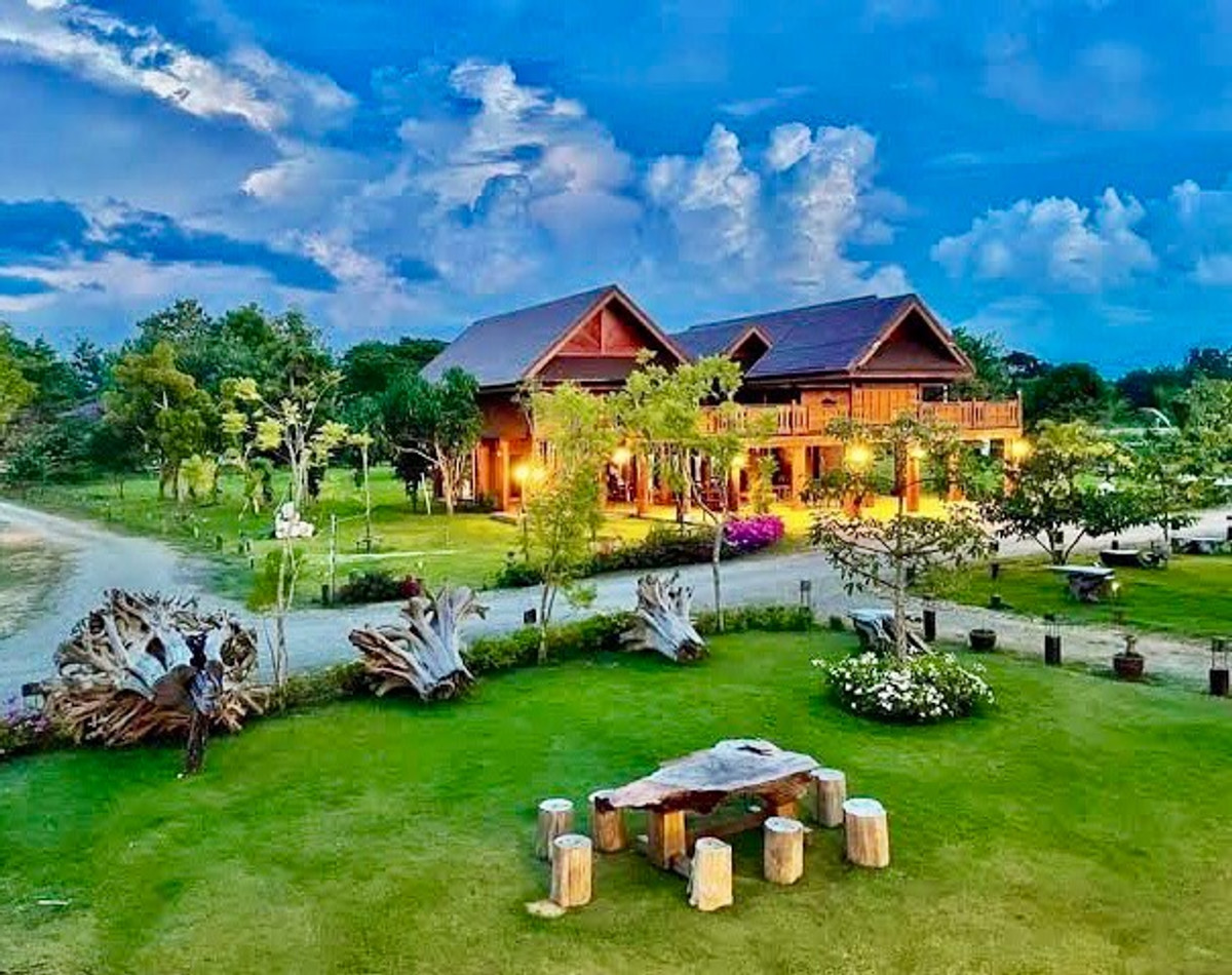 For SaleHousePhrae : Old teak houses for sale, large and small. Complete with train carriages On land in a prime location, Phrae Province, over 8 rai, next to the road along the irrigation canal, mountain view, cool and shady atmosphere mixed with the scent of nature in every