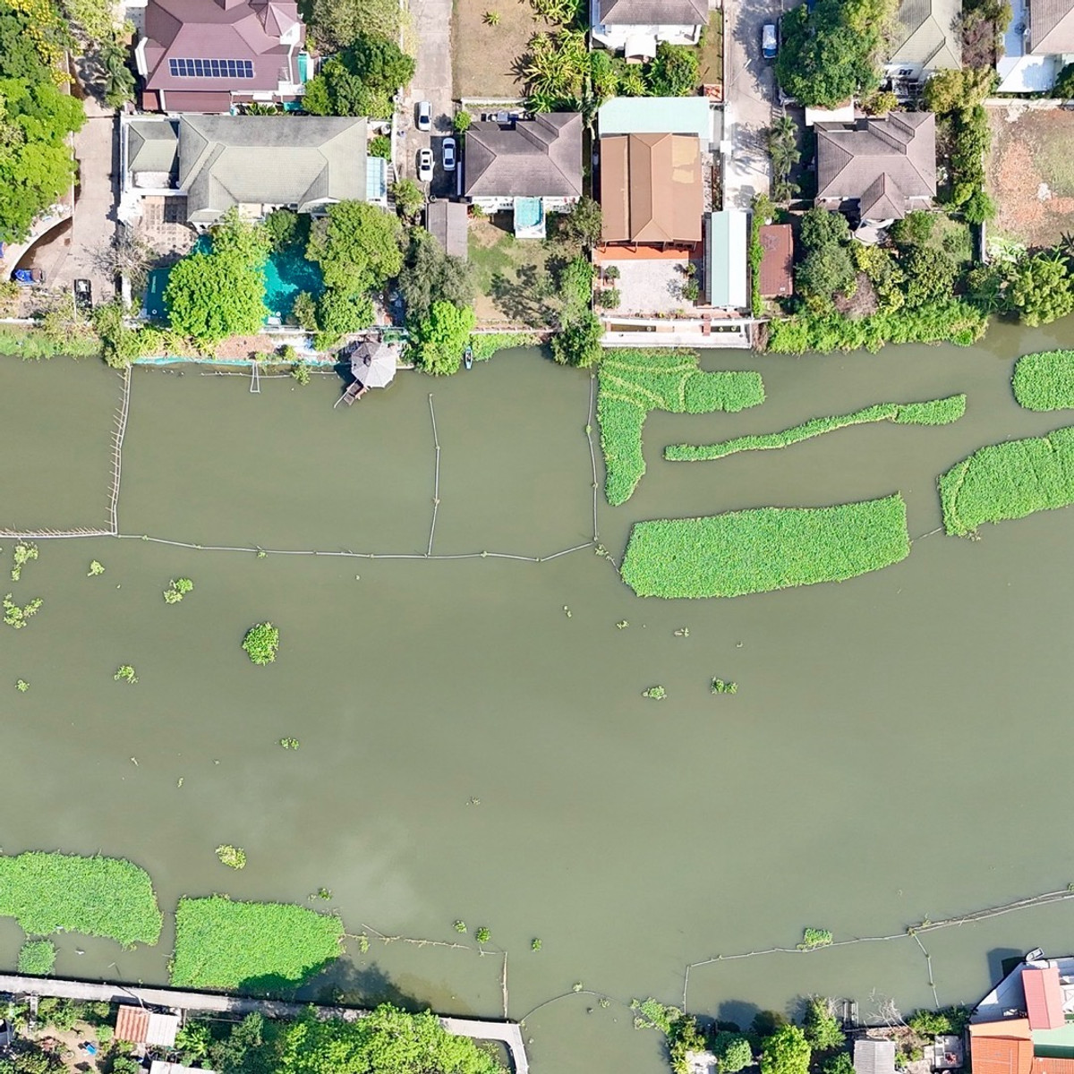 For SaleHousePathum Thani,Rangsit, Thammasat : Single house for sale, Maneerin Lake & Lagoon, Zone B, next to a canal approximately 115 meters wide.