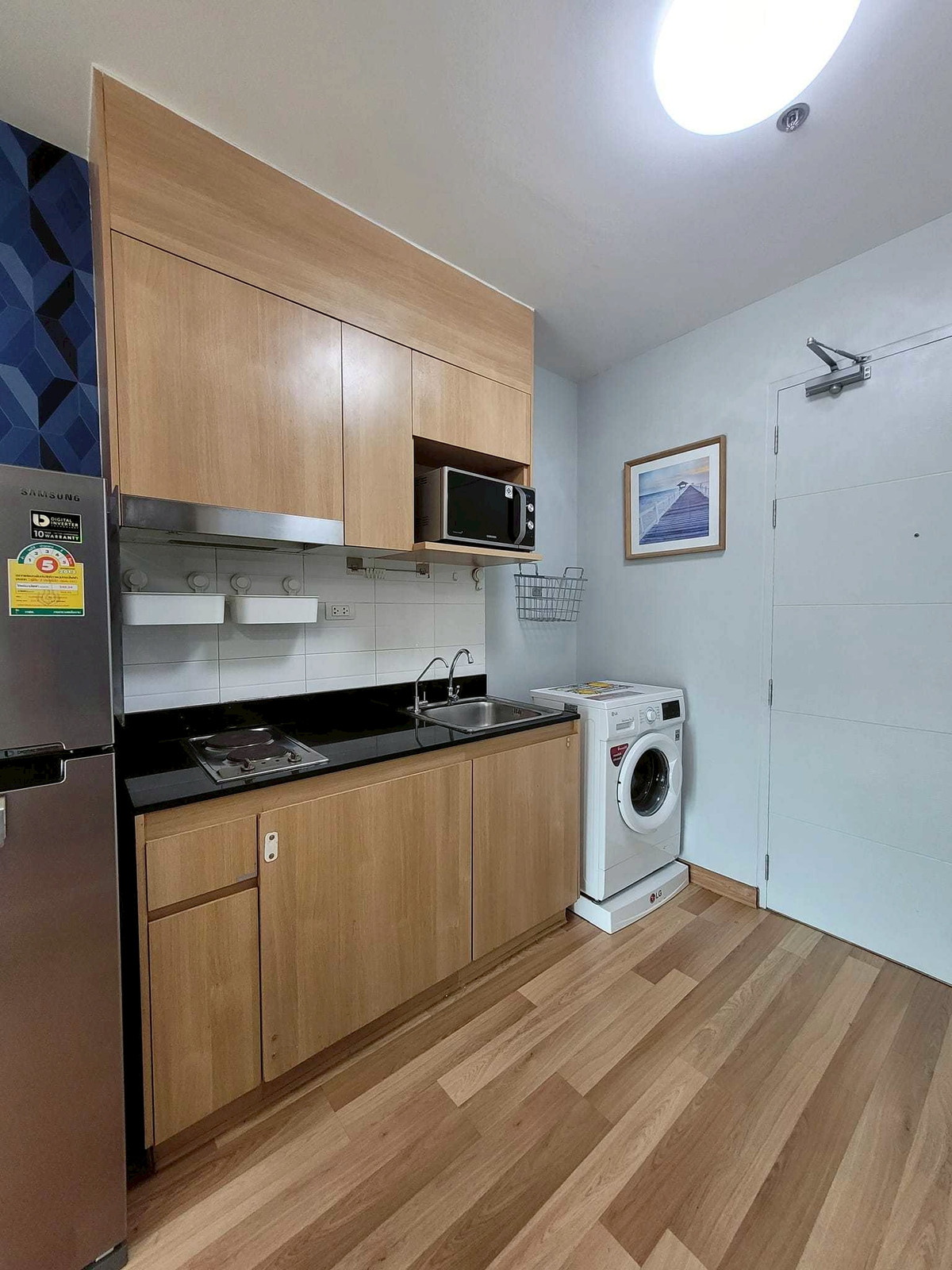 For RentCondoOnnut, Udomsuk : 💼 Working in Sukhumvit? This room is perfect for you! A fully furnished condo 📺❄️ with stylish modern patterned walls 🎨 Smart layout with a clearly separated living area 🛋️, making the space comfortable and functional